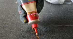 pack tile grout