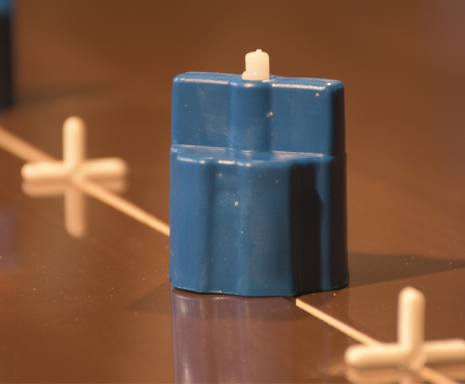Power screw leveler